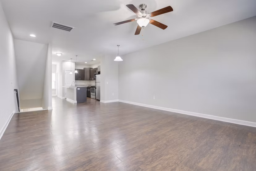 Spacious living room with modern decor in Charleston Row Townhomes apartments