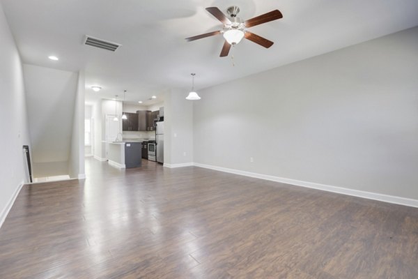 Spacious living room with modern decor in Charleston Row Townhomes apartments