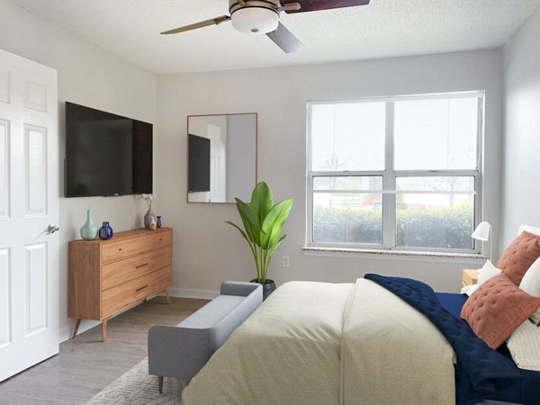 Cozy bedroom with stylish decor at The Spoke at McCullough Station Apartments, offering luxury living spaces