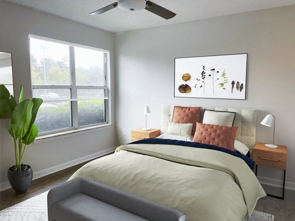 Cozy bedroom with modern decor at The Spoke At McCullough Station Apartments