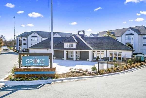 The Spoke At McCullough Station Apartments: Stylish lobby with modern decor and seating in a luxury clubhouse