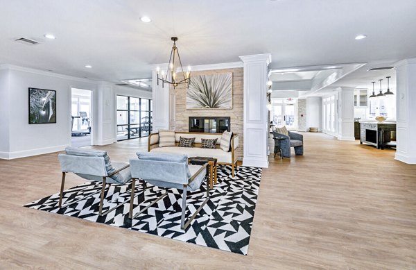 Lobby with modern seating and decor in The Spoke at McCullough Station Apartments