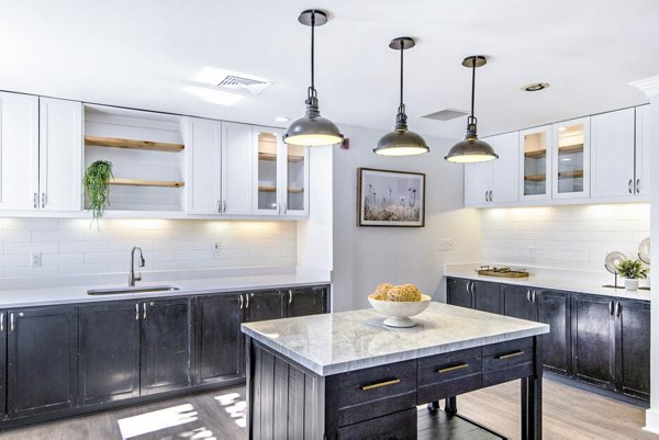Modern clubhouse with elegant lobby at The Spoke at McCullough Station Apartments, featuring luxury seating and decor
