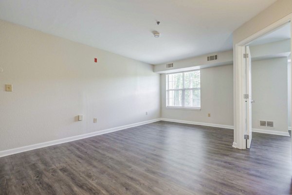 Modern living room with stylish decor in The Spoke at Tyvola Station Apartments