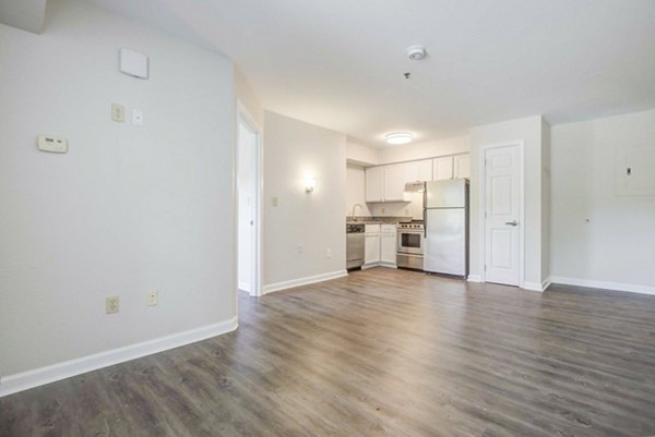 Spacious living room with modern decor at The Spoke at Tyvola Station Apartments
