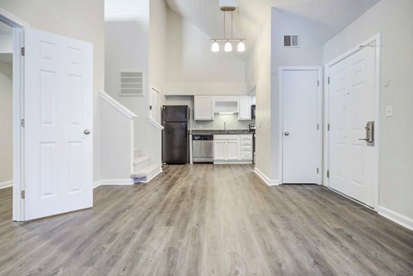 Spacious living room with modern decor at The Spoke at Tyvola Station Apartments
