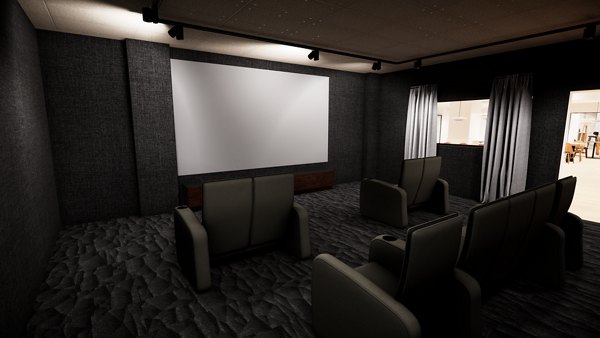 Dark room with a large screen and theater seating.