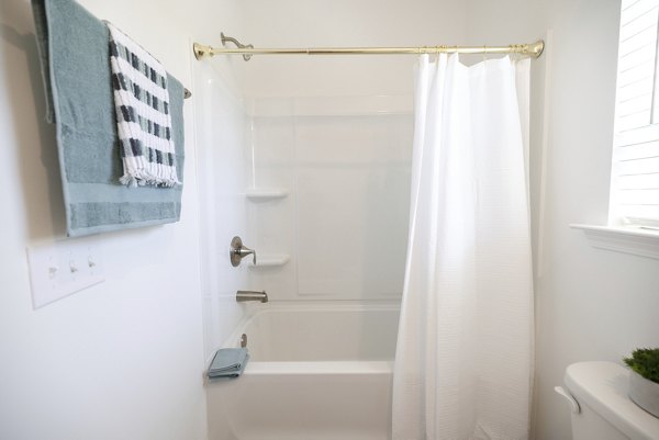 Modern bathroom with sleek fixtures at Reve on the Creek Apartments