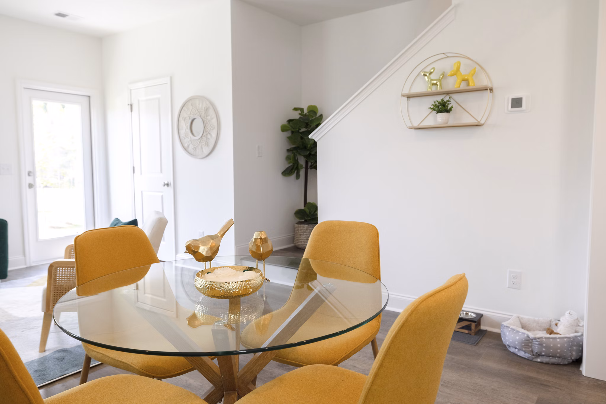 Dining room with elegant lighting and modern furnishings at Reve on the Creek Apartments