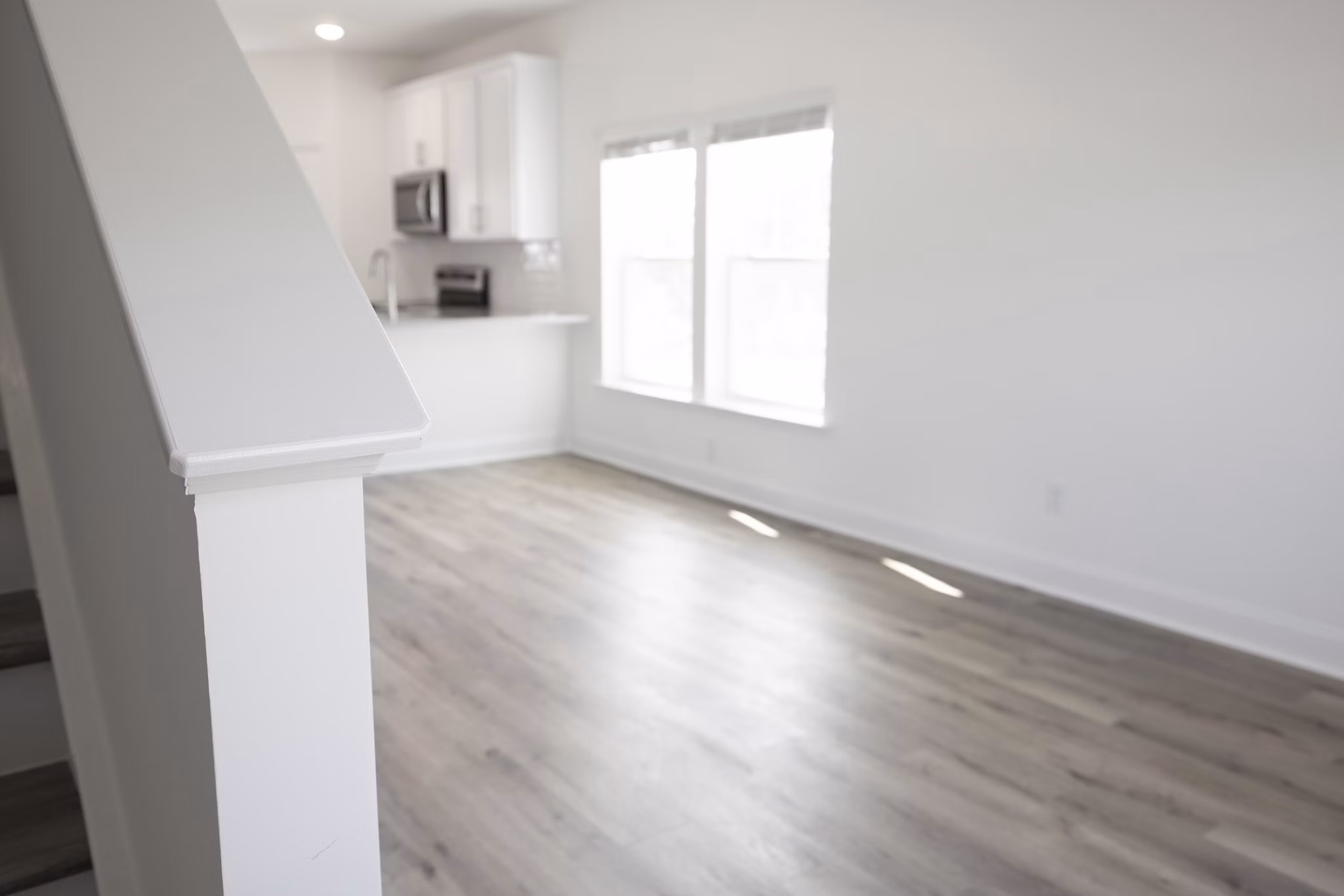 Elegant living room with modern furnishings at Reve on the Creek Apartments, showcasing spacious design and luxury features