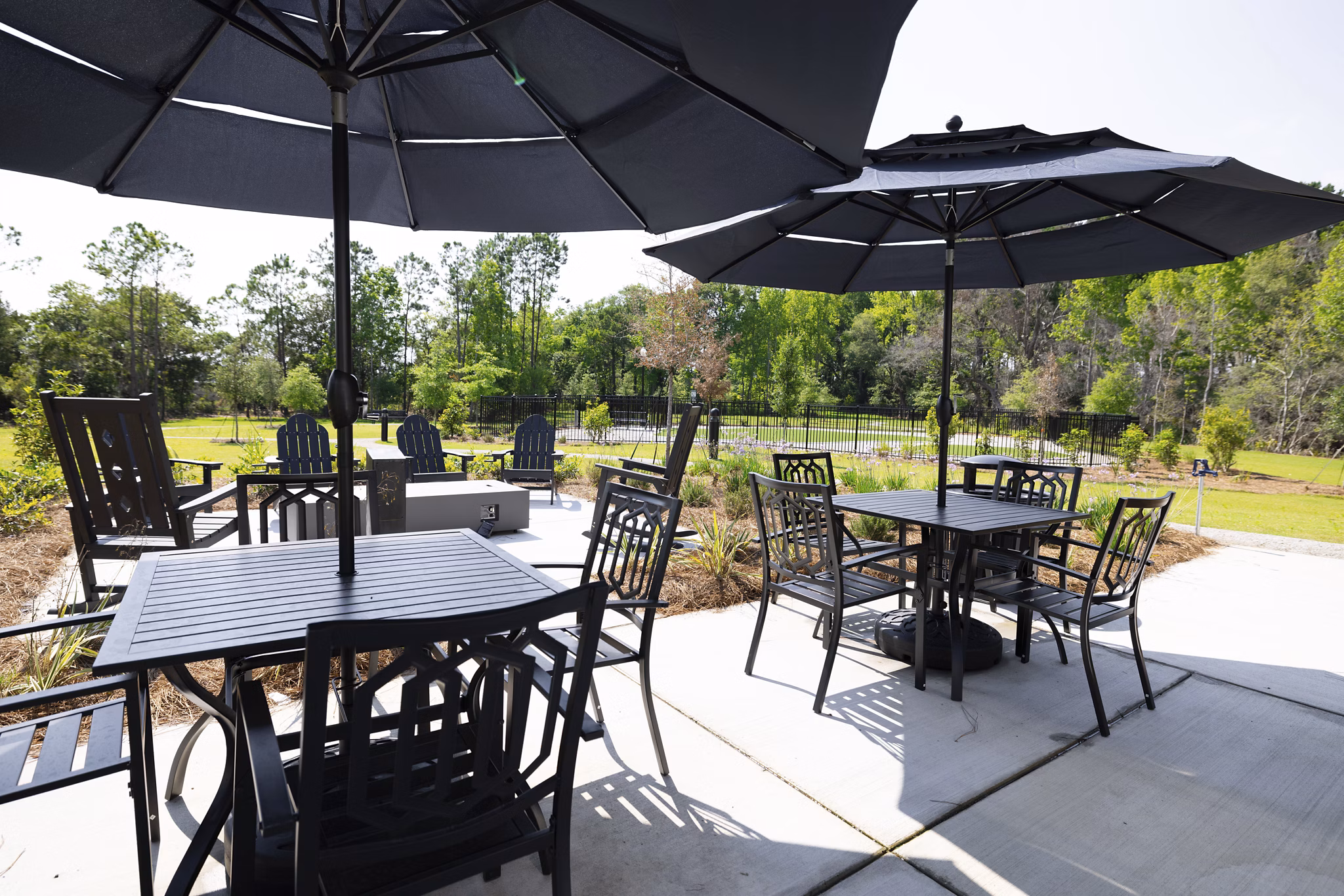Fire pit on patio at Reve on the Creek: Modern outdoor amenity for residents to enjoy cozy evenings and social gatherings, enhancing luxury apartment living