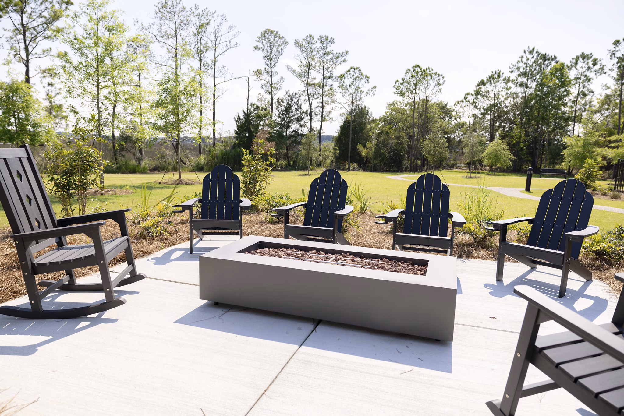 Fire pit on patio at Reve on the Creek Apartments, offering luxurious outdoor living spaces