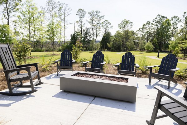 Fire pit on patio at Reve on the Creek Apartments, offering luxurious outdoor living spaces