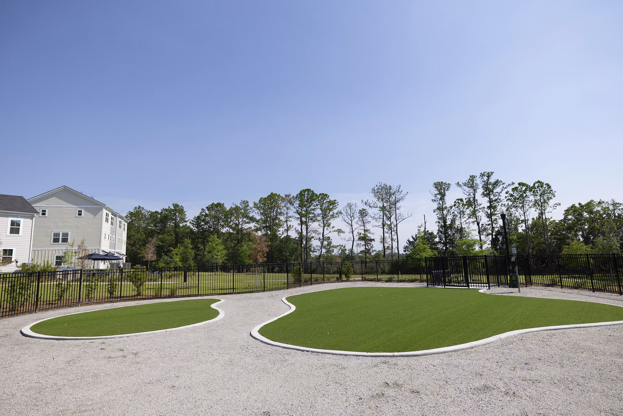 Practice putting green at Reve on the Creek Apartments offering luxurious leisure activities for residents