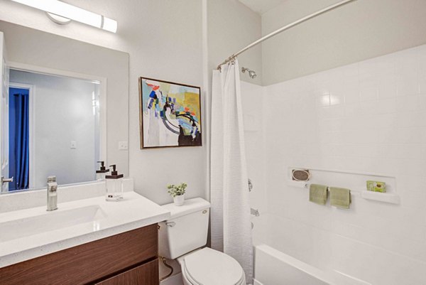 Spacious bathroom featuring modern fixtures at Citron Apartments with luxury amenities