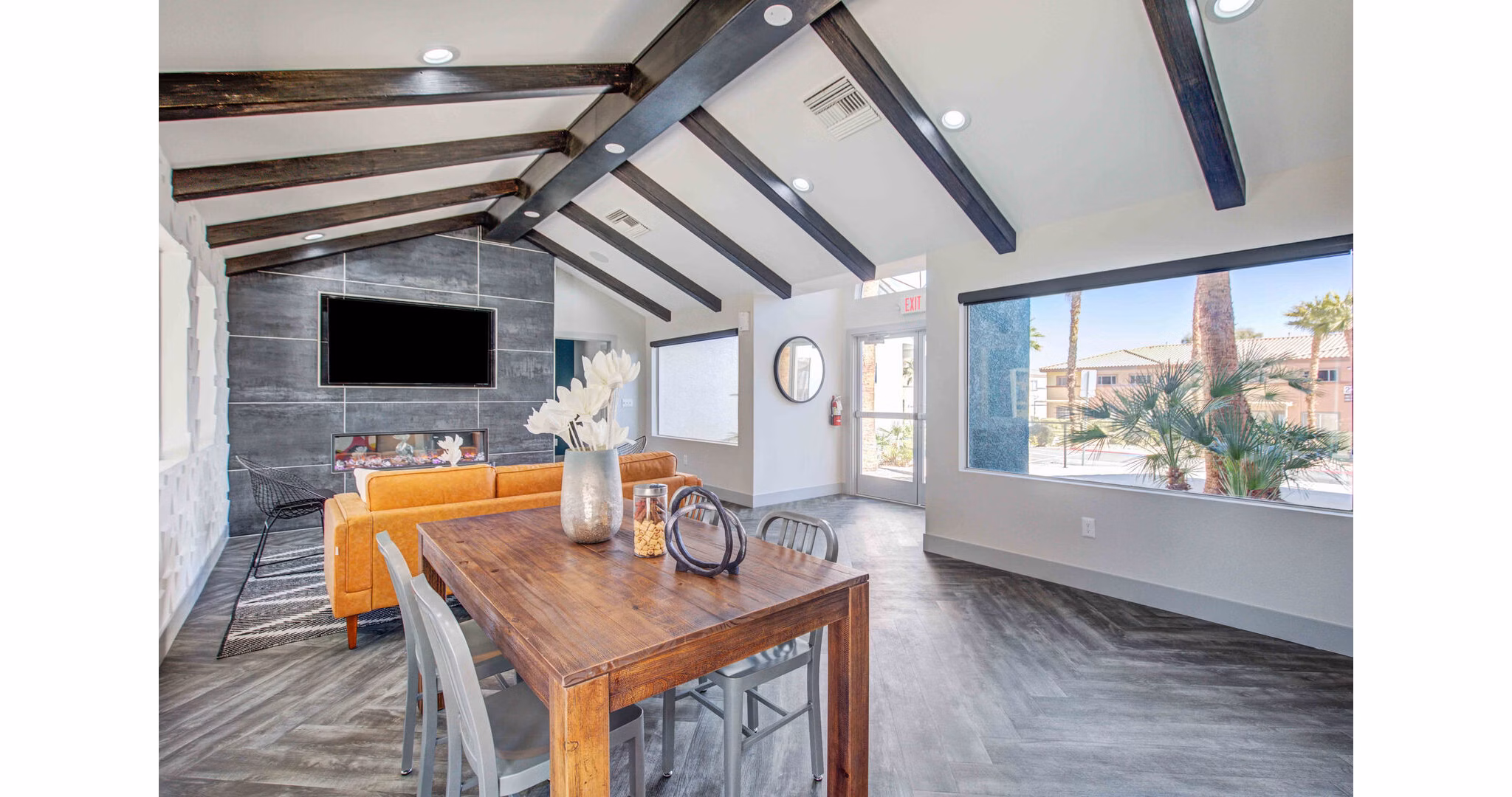 Clubhouse featuring stylish modern design and seating areas at Citron Apartments