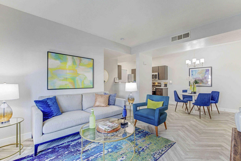 Spacious living room with modern decor and natural light in Citron Apartments