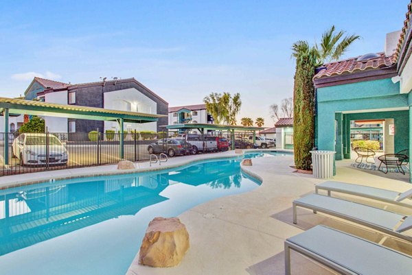 Modern outdoor pool area with lounge chairs at Citron Apartments, perfect for relaxation and socializing
