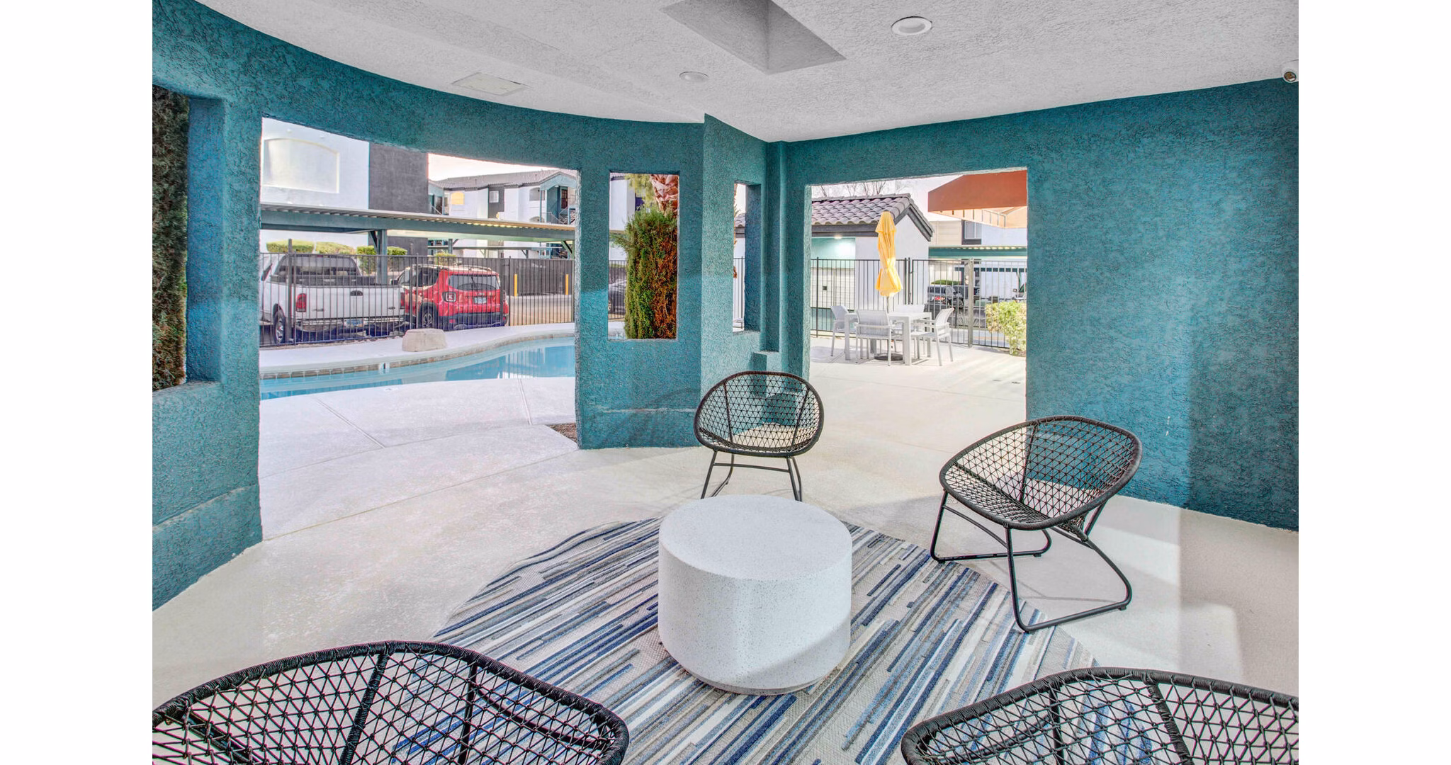 Outdoor patio with modern seating at Citron Apartments
