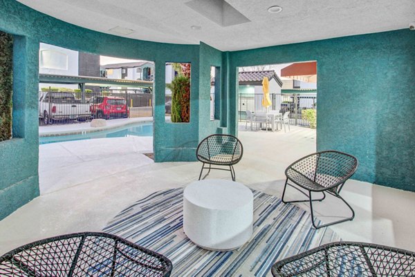 Outdoor patio with modern seating at Citron Apartments