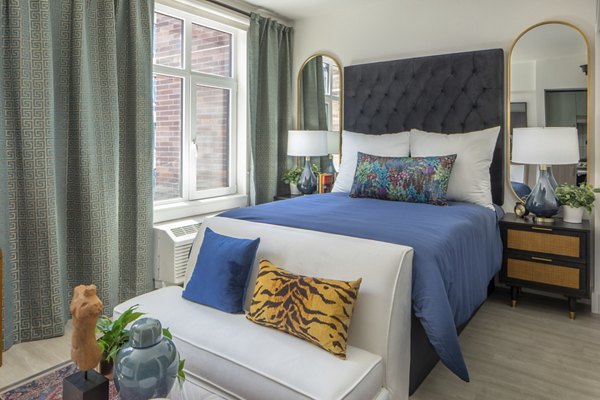 Cozy bedroom with modern decor at Millhouse Apartments