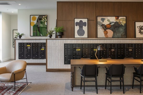 Mail room with organized parcel lockers at Millhouse Apartments