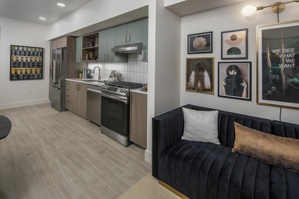 Spacious living room with modern decor and natural light at Millhouse Apartments