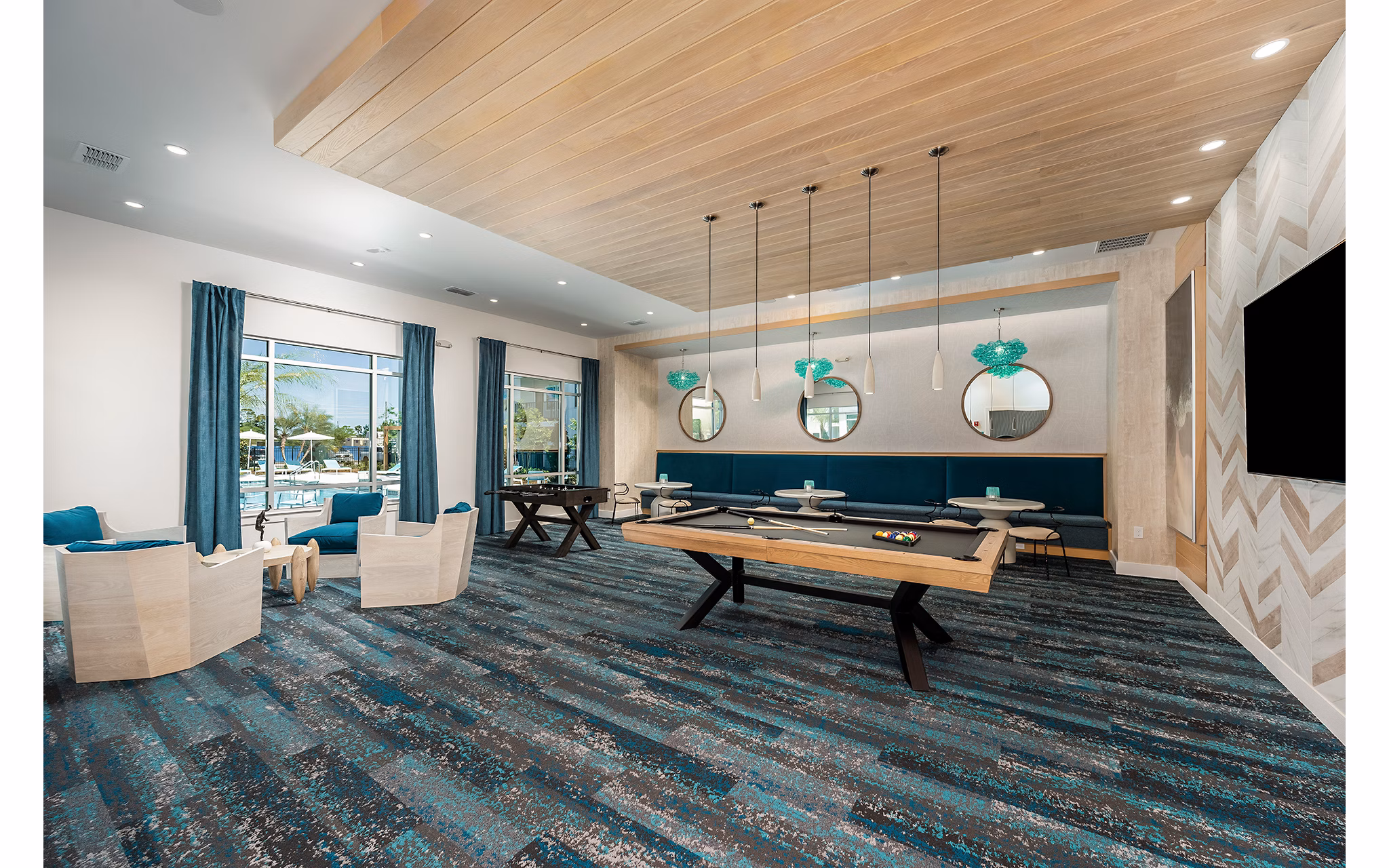 Clubhouse featuring modern design and cozy seating areas at Perla Apartments, luxury living in the heart of the city