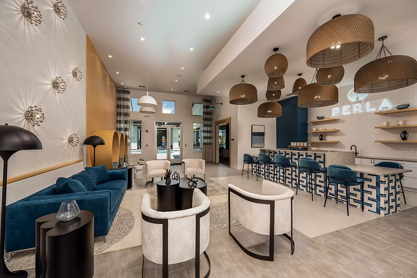 Clubhouse with modern design and communal spaces at Perla Apartments, luxury living by Greystar