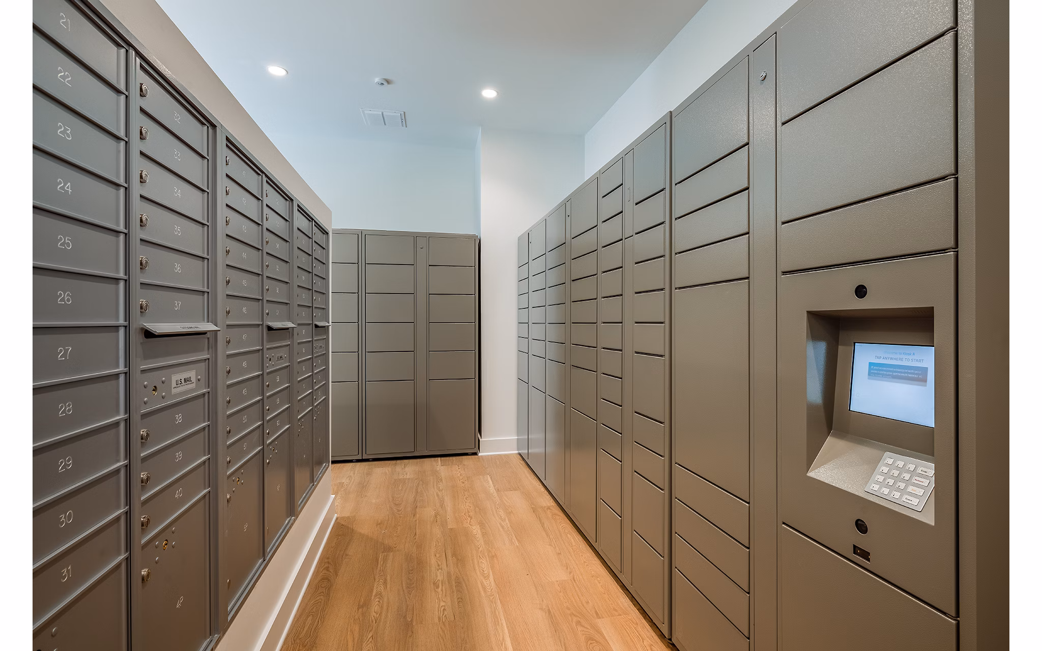 Efficient mail room with secure parcel lockers in Perla Apartments, offering convenience for residents of these luxury apartments