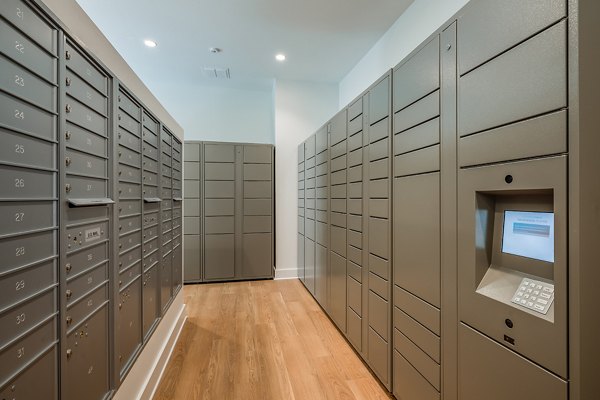 Efficient mail room with secure parcel lockers in Perla Apartments, offering convenience for residents of these luxury apartments