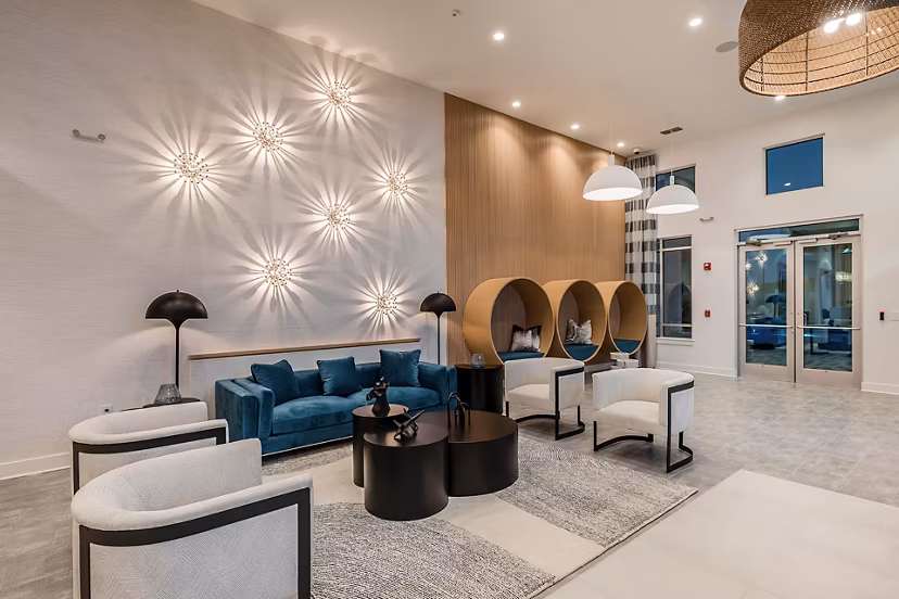 Perla Apartments: Contemporary clubhouse with stylish dÃ©cor and ample seating in vibrant downtown location