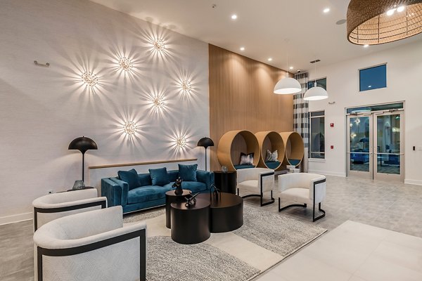 Perla Apartments: Contemporary clubhouse with stylish dÃ©cor and ample seating in vibrant downtown location