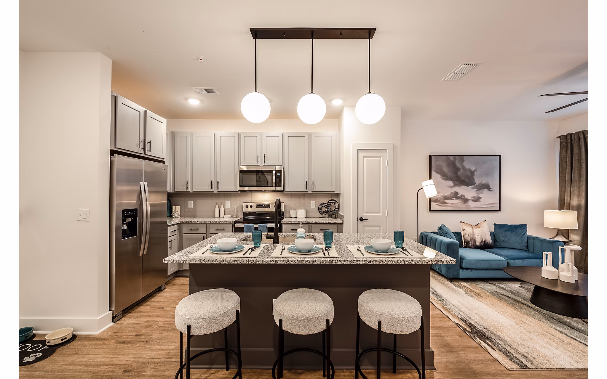 Modern kitchen with stainless steel appliances in Perla Apartments luxury living
