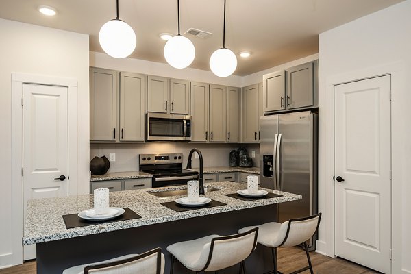 Modern kitchen with stainless steel appliances at Perla Apartments