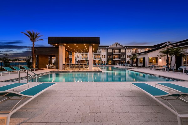 Rooftop pool with city skyline views at Perla Apartments