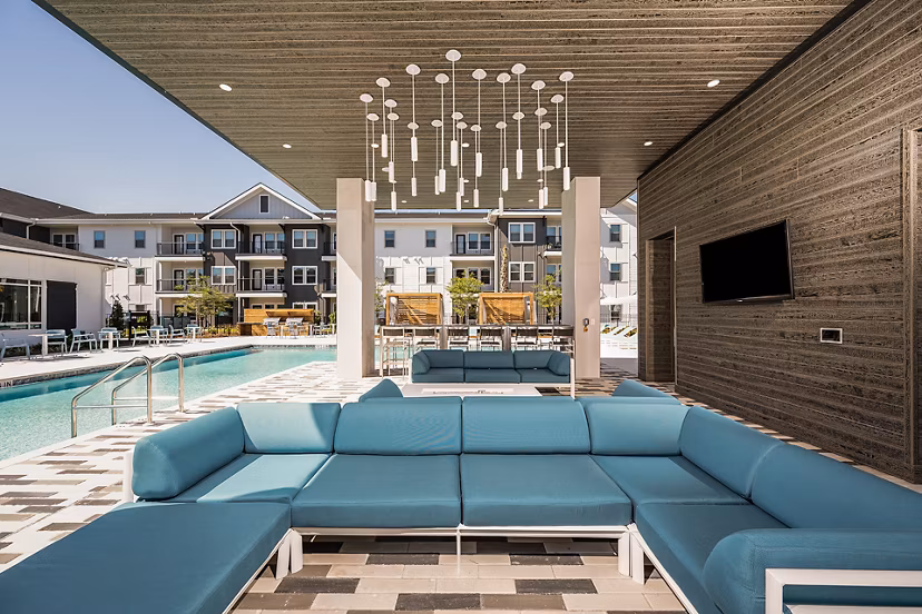 Chic patio adorned with lush greenery at Perla Apartments, perfect for relaxation in a luxury setting