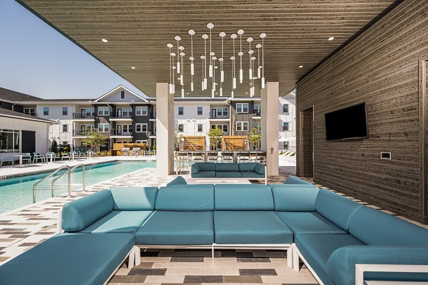Chic patio adorned with lush greenery at Perla Apartments, perfect for relaxation in a luxury setting