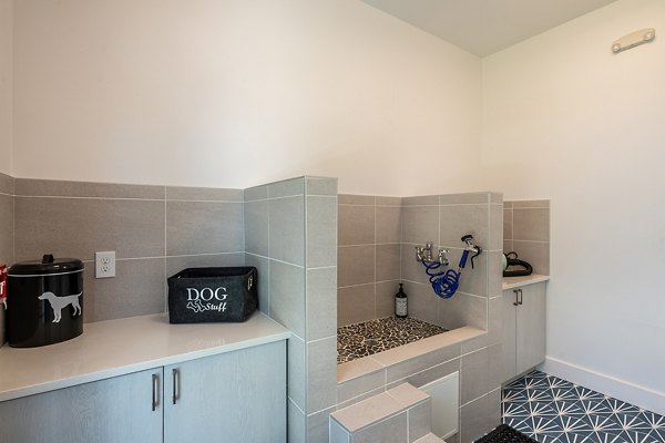 Convenient dog wash station at Perla Apartments, luxury living for pet owners