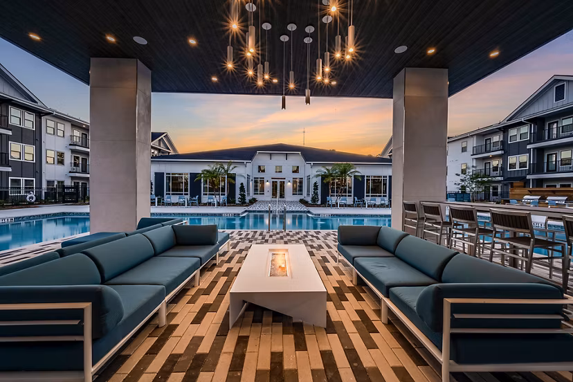 Cozy outdoor fire pit area at Perla Apartments, a Greystar luxury community