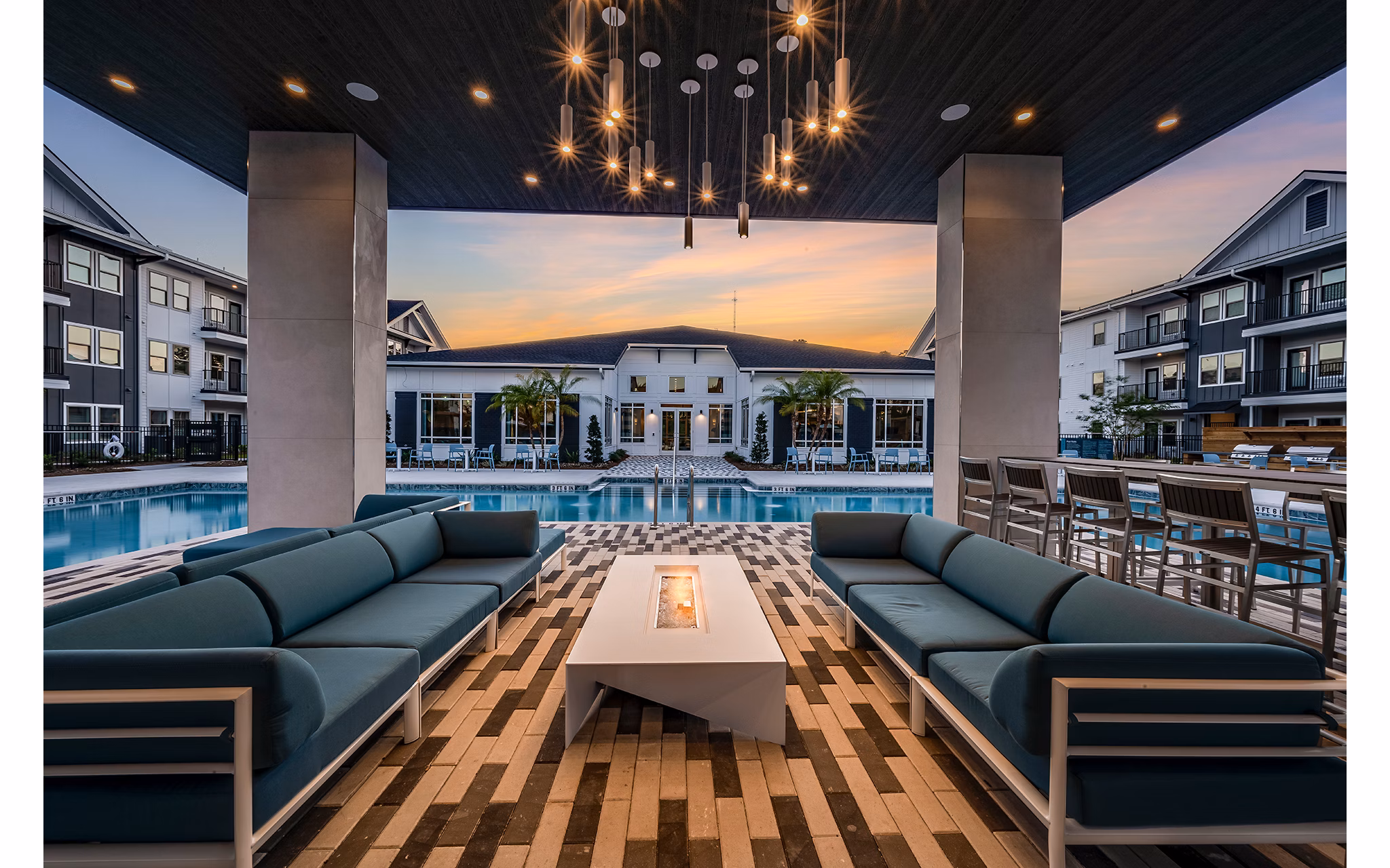 Cozy outdoor fire pit area at Perla Apartments, a Greystar luxury community