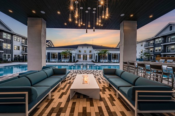 Cozy outdoor fire pit area at Perla Apartments, a Greystar luxury community