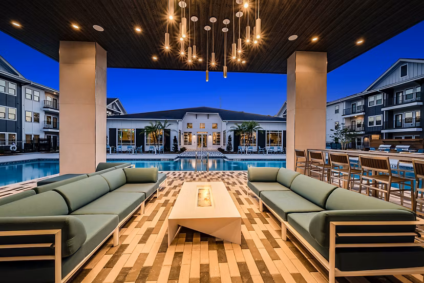 Cozy outdoor area with fire pit at Perla Apartments, offering a relaxing ambiance for residents and guests