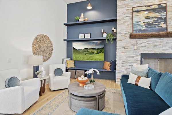 Clubhouse featuring modern design and cozy seating at Emerson at Trace Apartments