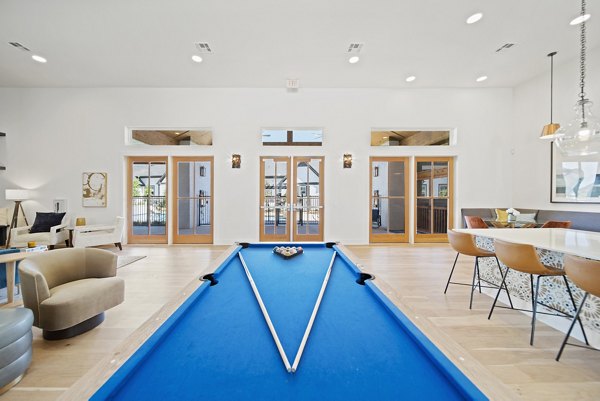 Entertainment-packed clubhouse game room at Emerson at Trace Apartments