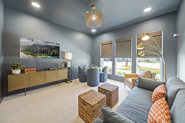 Bright and modern clubhouse with comfortable seating at Emerson at Trace Apartments