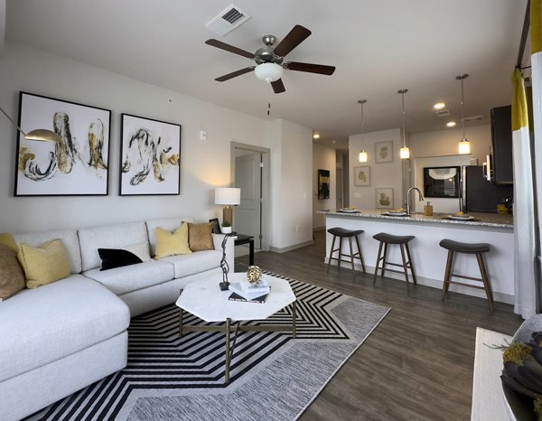 Spacious living room with modern decor at The Fitzroy at Lebanon Marketplace Apartments