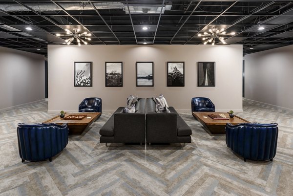 Clubhouse featuring modern dÃ©cor and spacious seating at The Lofts at Westgate Apartments