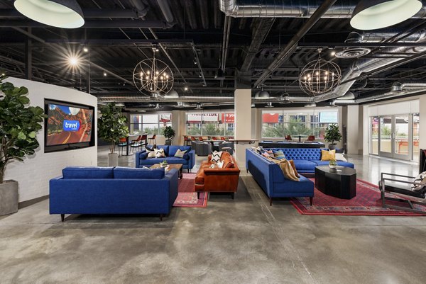 Modern clubhouse with stylish seating and entertainment area at The Lofts at Westgate Apartments