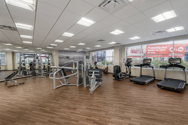 Modern fitness center with advanced equipment at The Lofts at Westgate Apartments